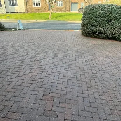 The same block-paved driveway after cleaning with bright, refilled joints