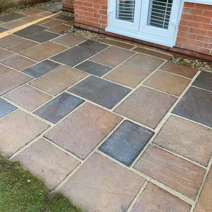 The same patio after cleaning, sandstone colour restored